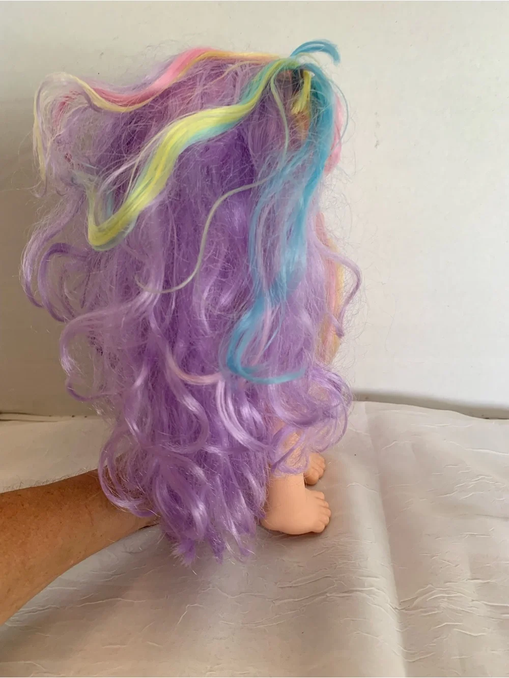 Kindi Kids Rainbow Kate doll with pastel hair and large glitter eye